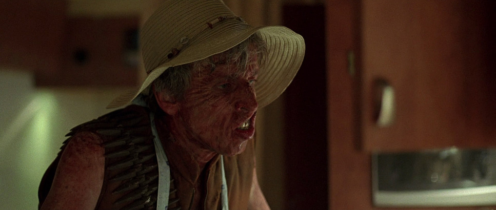 deformed mutant wearing a woman's sun hat