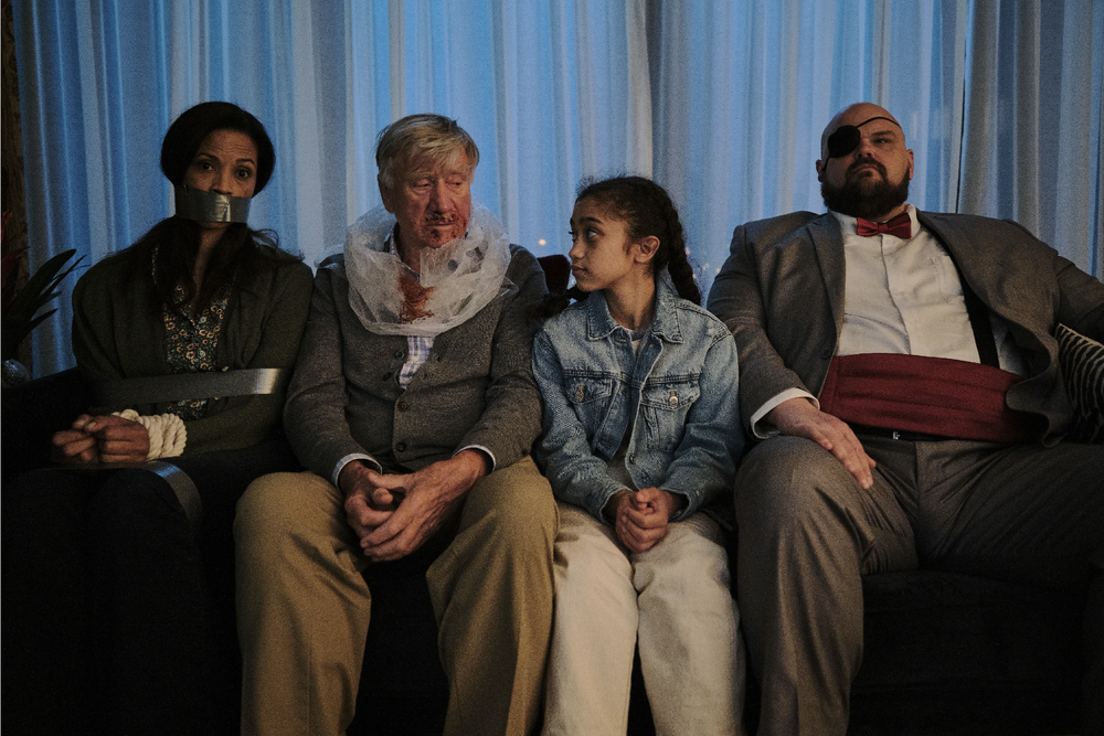 people held hostage on a couch 